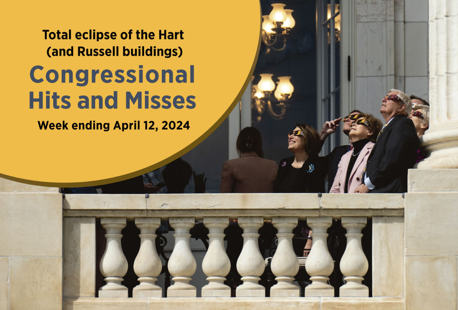 From left: Sens. Amy Klobuchar, Richard Blumenthal, Jeanne Shaheen, Lindsey Graham and Elizabeth Warren watch the solar eclipse on the balcony of the Russell Senate Office Building on Monday. 