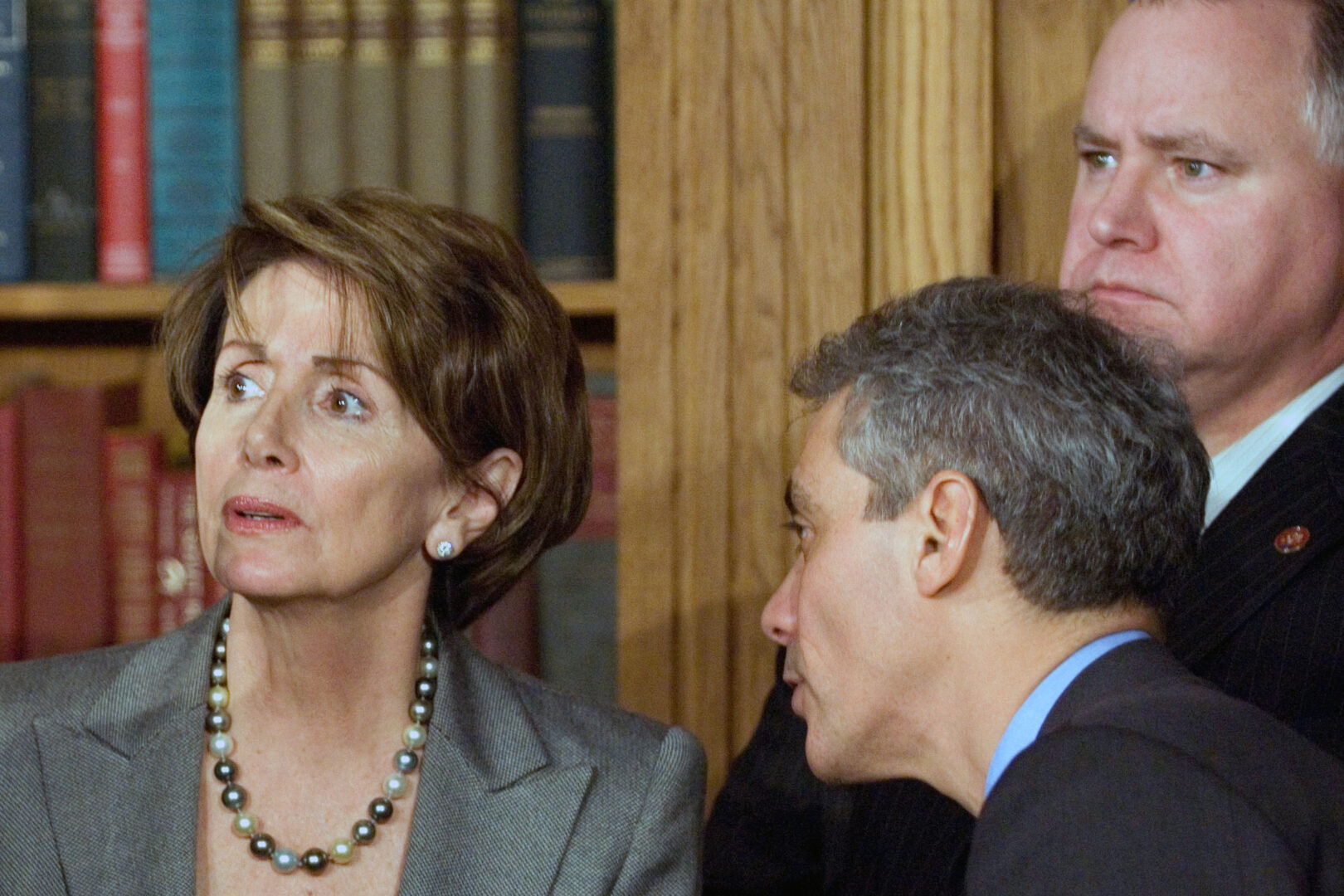 Democratic Caucus Chairman Rahm Emanuel, D-Ill., center, whispers to Speaker Nancy Pelosi as freshman Rep. Tim Walz, D-Minn., looks on during a news conference following a House vote on a non-binding resolution on the Iraq war on Feb. 16, 2007. 