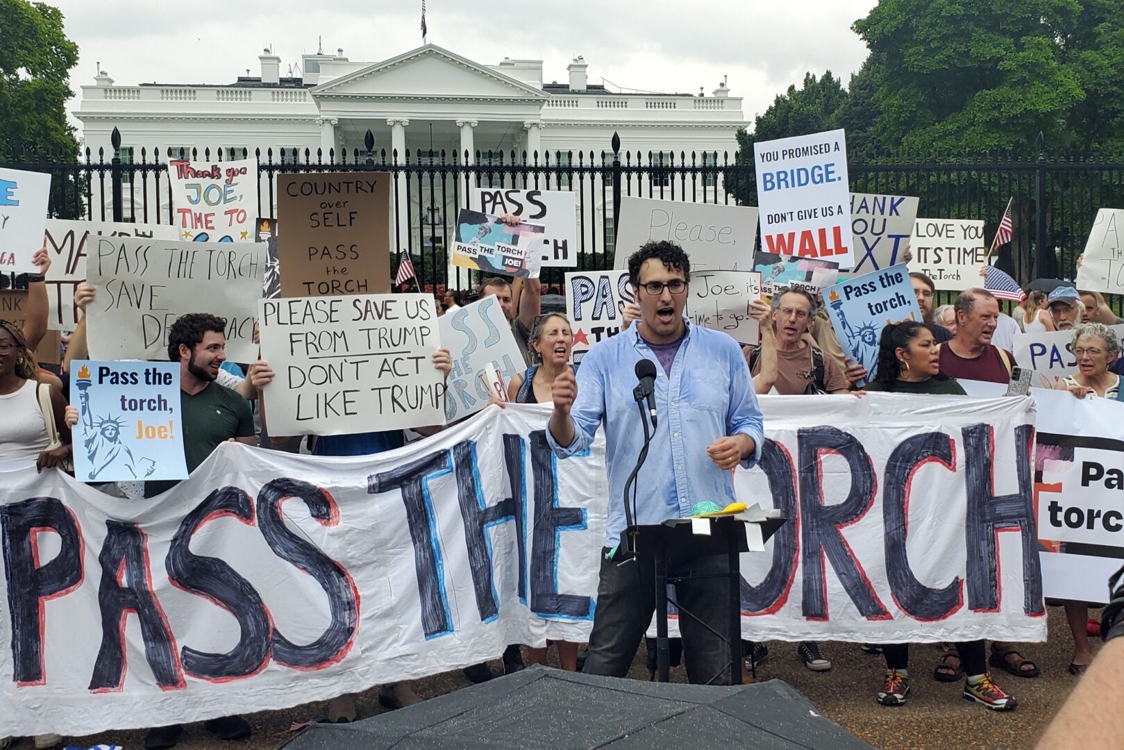 Aaron Regunberg, a member of the Pass the Torch Steering Committee, leads the crowd in a chant urging President Joe Biden to drop his bid for reelection at a demonstration outside the White House on Saturday.