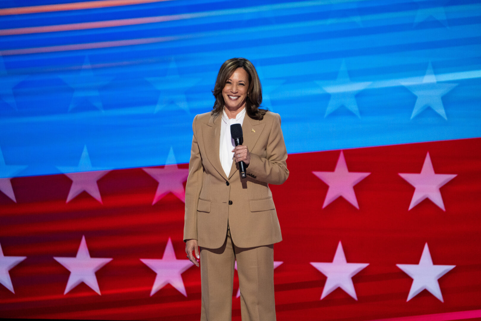 Vice President Kamala Harris makes a surprise appearance on stage during the 2024 Democratic National Convention at the United Center in Chicago on Monday. (Bill Clark/CQ Roll Call)