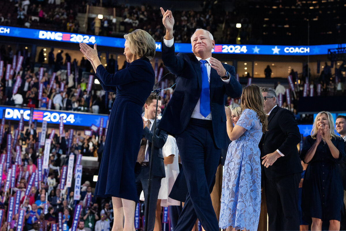 Minnesota Gov. Tim Walz, Democratic vice presidential nominee, and his wife Gwen,  acknowledge the crowd after he spoke on the third night of the Democratic National Convention at the United Center in Chicago, Ill., on Wednesday.