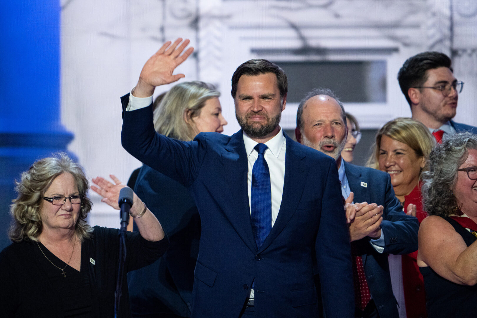 Sen. JD Vance, R-Ohio, stands on stage with family after addressing the Republican National Convention on July 17. 