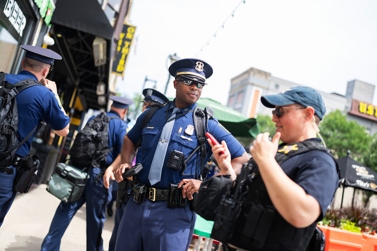 Lt. T.K. Williams, Jr., of the Michigan State Police is seen along with a uniformed Secret Service officer and security officials on North Dr. M.L.K. Jr. Drive near the Fiserv Forum ahead of the Republican National Convention in Milwaukee on Sunday. 