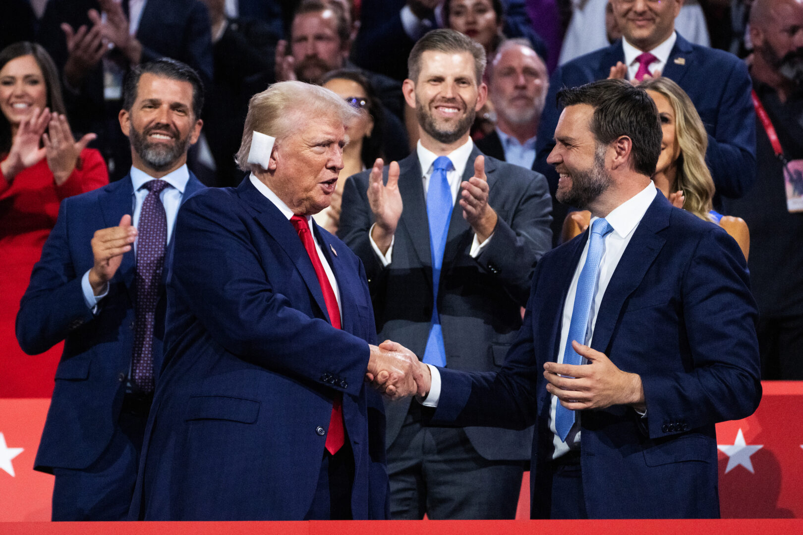 Former President Donald Trump, the Republican presidential nominee, greets his running mate, Sen. J.D. Vance of Ohio, in Fiserv Forum on the first day of the Republican National Convention in Milwaukee.