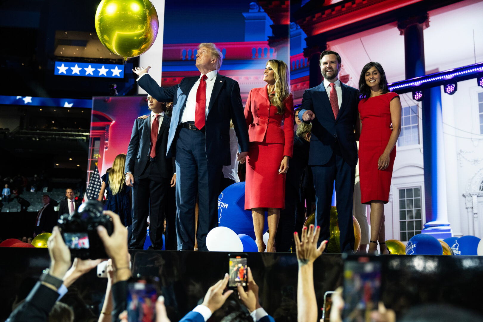 From left, former President Donald Trump, the Republican nominee for president, wife Melania, Ohio Sen. JD Vance, the vice presidential nominee, and his wife Usha Chilukuri Vance, celebrate on stage at the Fiserv Forum on Thursday, the final day of the Republican National Convention in Milwaukee, Wis.