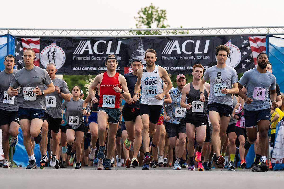 Runners take off from the starting line during the ACLI Capital Challenge 3-mile race in Anacostia Park on Wednesday, May 17, 2023. 