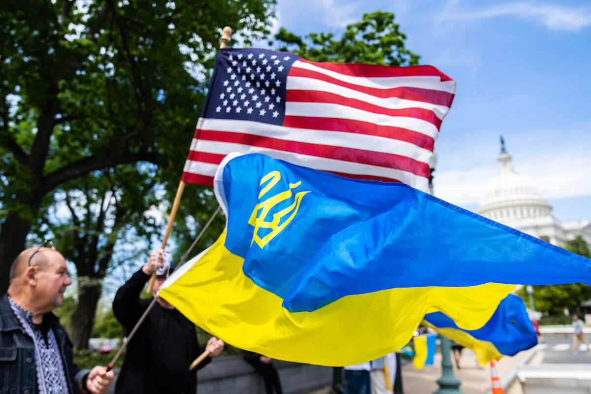 Demonstrators supporting Ukraine funding are seen outside the Capitol before the House passed the foreign aid package on Saturday.