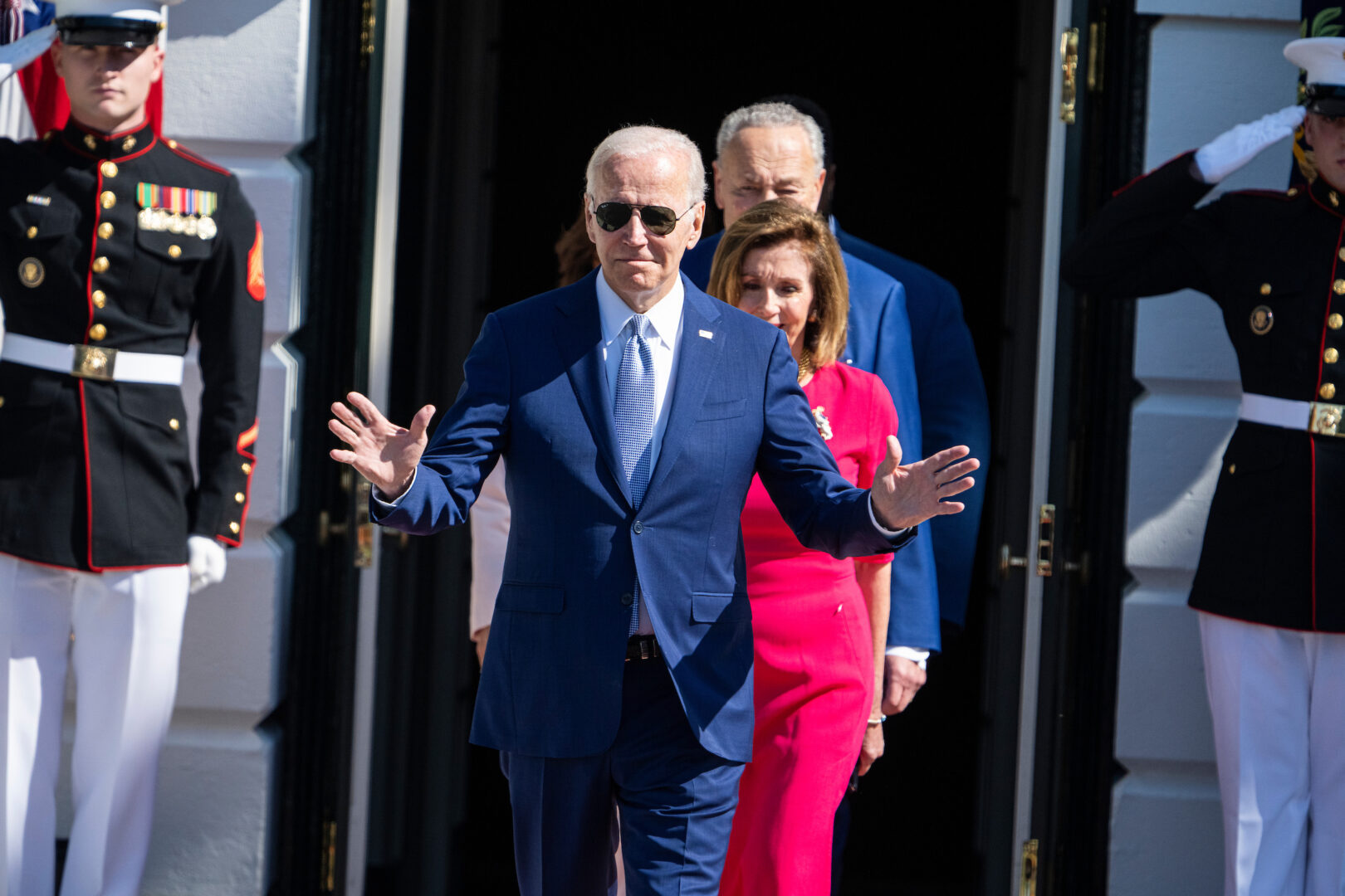 President Joe Biden, Speaker Nancy Pelosi, D-Calif., and Senate Majority Leader Charles E. Schumer, D-N.Y., arrive for the CHIPS and Science Act of 2022 bill signing on the South Lawn of the White House on Aug. 9, 2022.