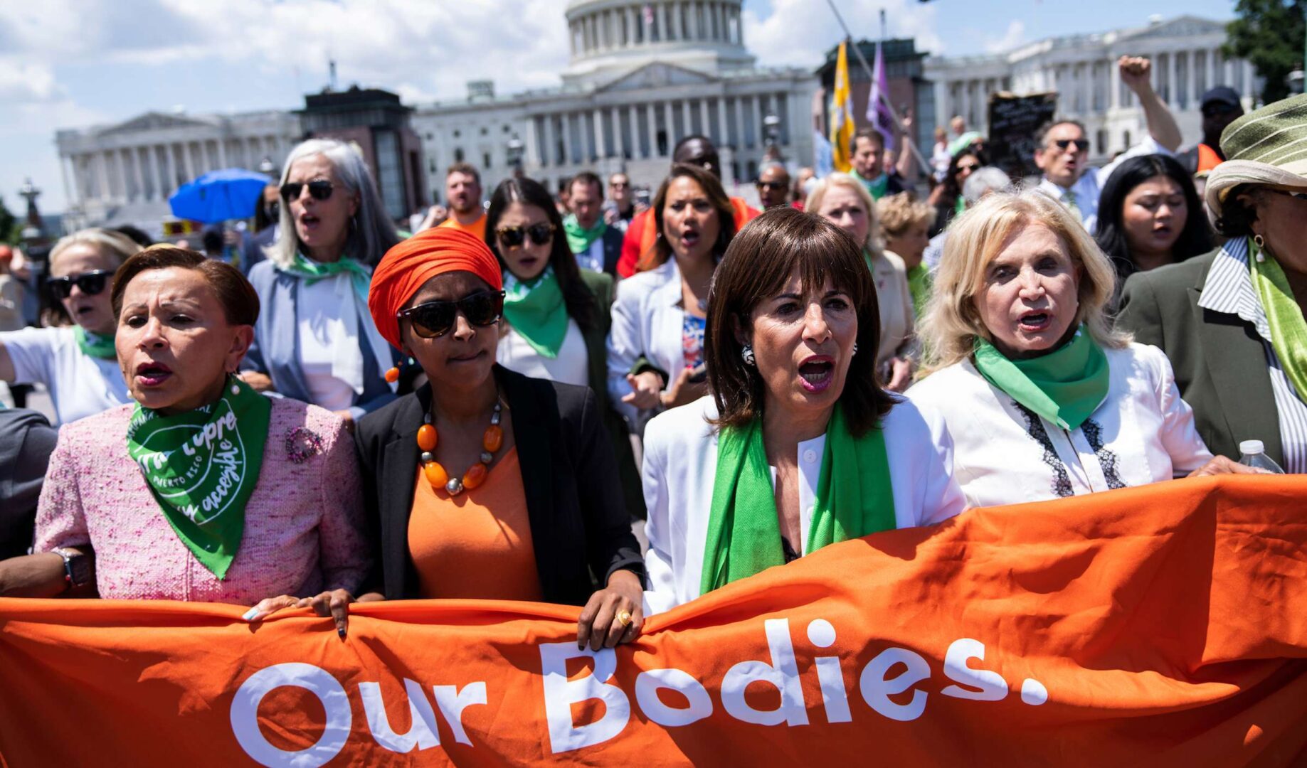 First row from left, Democratic Reps. Nydia M. Velázquez, Ilhan Omar, Jackie Speier and Carolyn B. Maloney make their way to the Supreme Court on July 19 for a sit-in to protest the court’s decision to overturn Roe v. Wade.