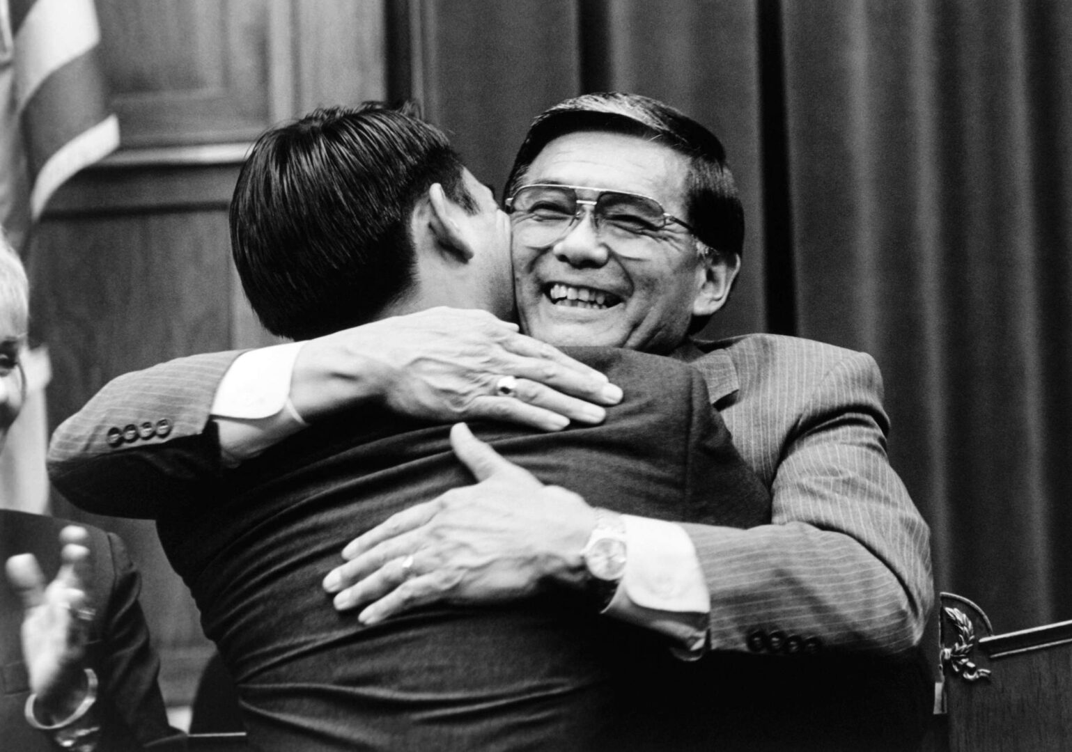 Former Rep. Norman Mineta, D-Calif, hugs his son Stuart during the unveiling of his portrait in 1995.