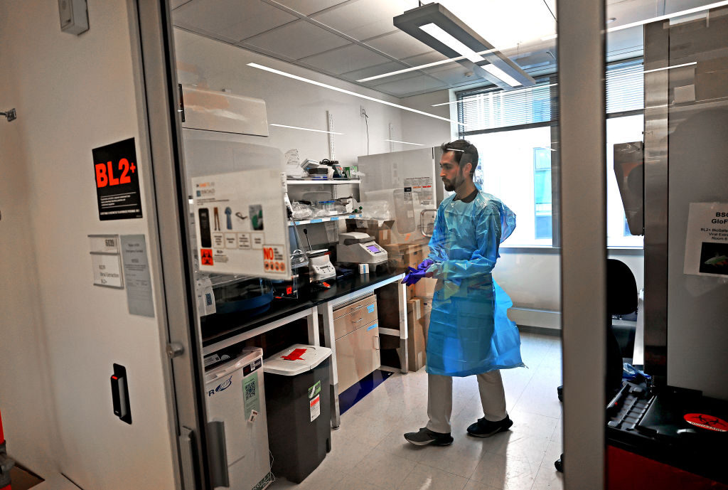 Jon Arizti Sanz works in a Massachusetts lab on May 14 testing milk purchased at area grocery stores for the presence of bird flu. 