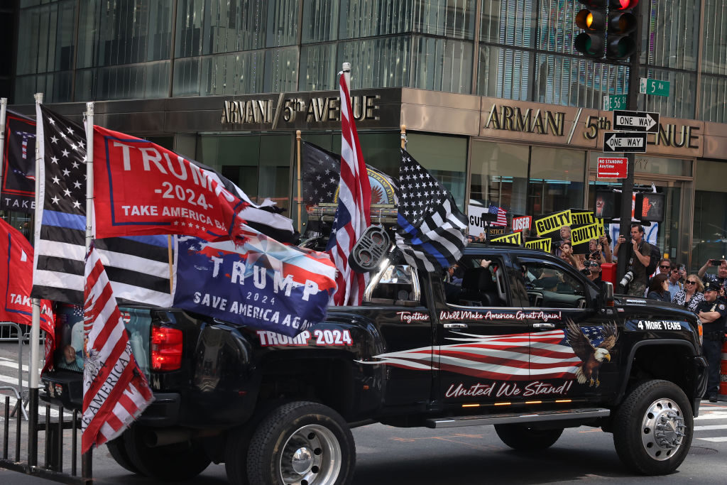 People gather outside Trump Tower in New York as Donald Trump holds a post-conviction press conference on May 31. His fans are loud and proud of their guy, no matter what a jury decided, Curtis writes.