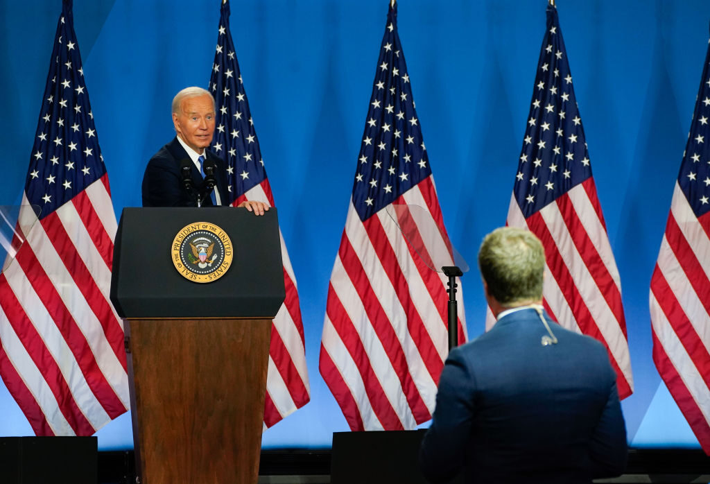 President Joe Biden take a questions from a reporter during a press conference at the Walter E. Washington Convention Center on Thursday evening. 