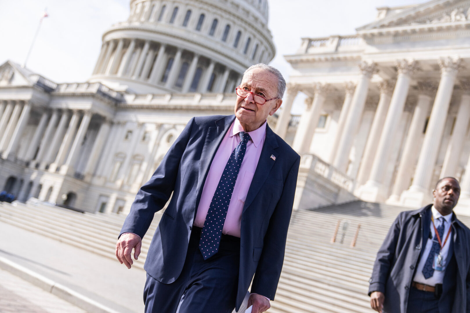 Senate Majority Leader Charles E. Schumer, D-N.Y., walks down the steps outside the Senate side of the Capitol on Wednesday.