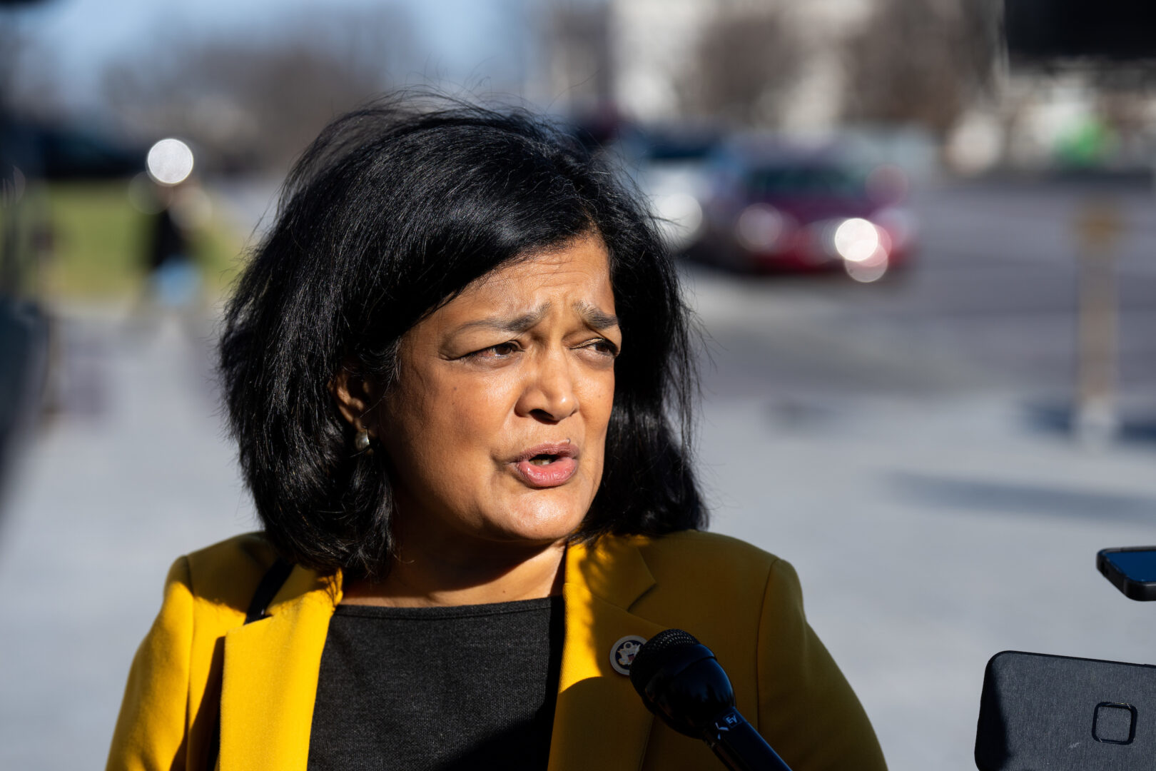 Rep. Pramila Jayapal, D-Wash., stops to speak to reporters as she arrives for the last votes of the week in the Capitol on Jan. 12, 2024. 