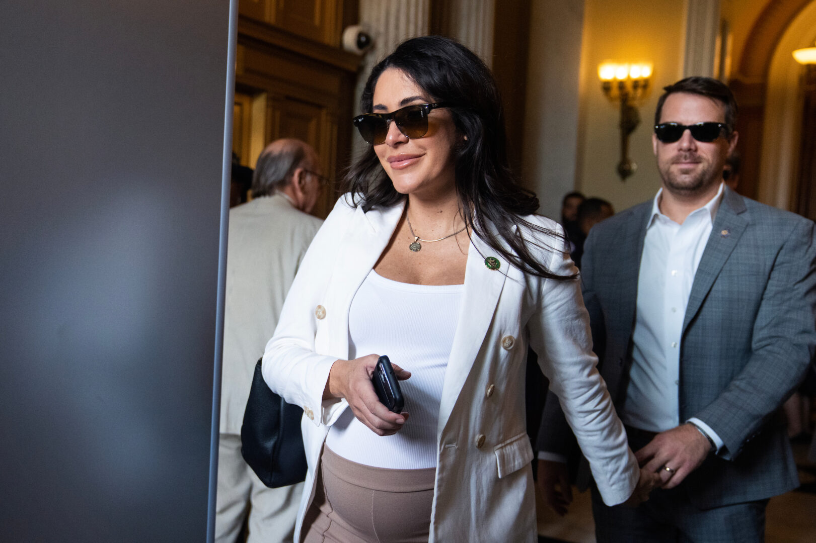 Rep. Anna Paulina Luna, R-Fla., seen leaving the Capitol with husband, Andrew Gamberzky, in July, has proposed allowing proxy voting after a member gives birth to a child. 