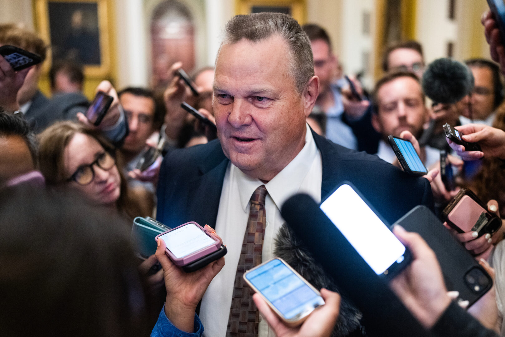 Sen. Jon Tester, D-Mont., speaks to reporters in the Capitol on July 9. 