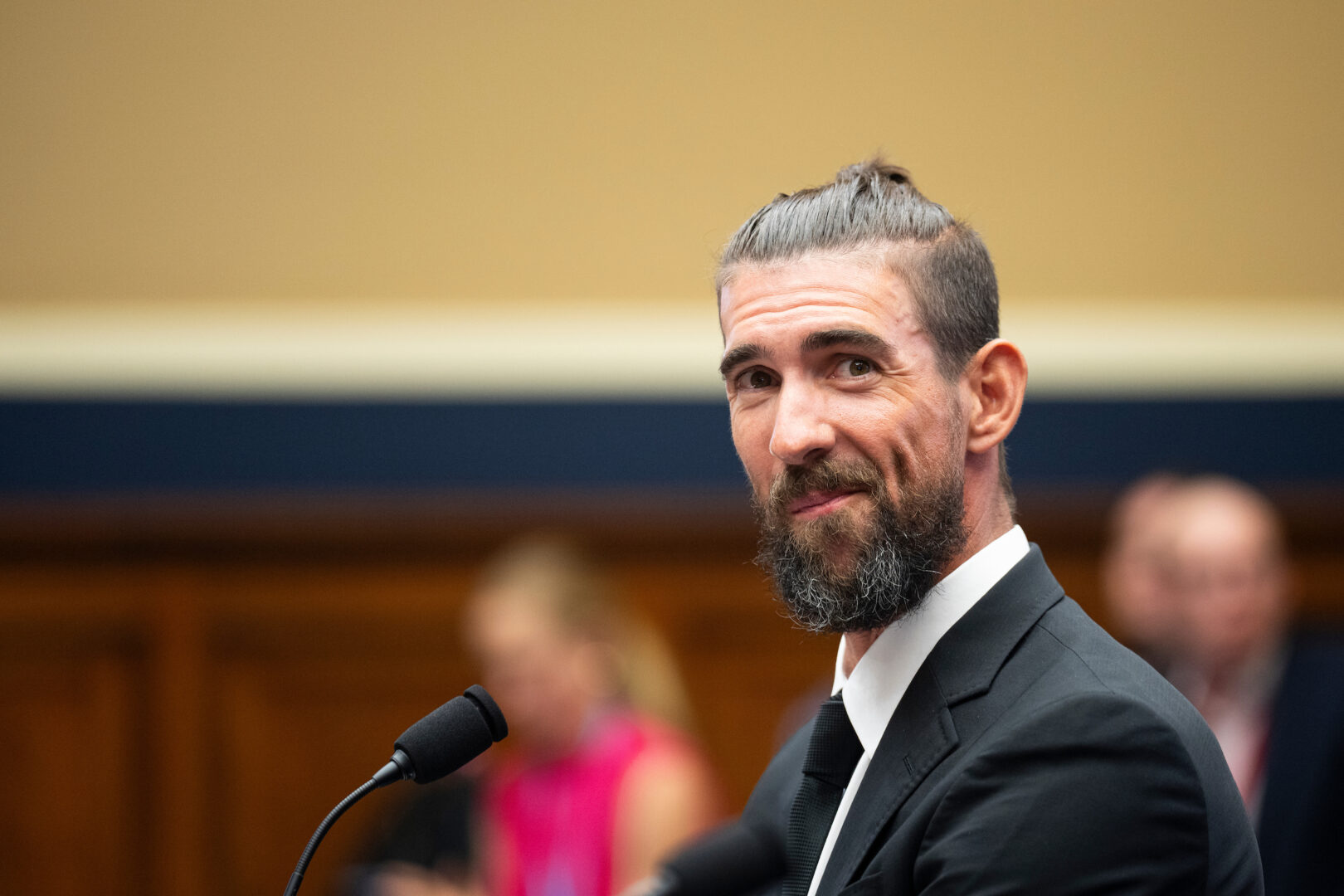 Olympic swimming gold medalist Michael Phelps takes his seat to testify during the House Energy and Commerce Subcommittee on Oversight and Investigations hearing on “Examining Anti-Doping Measures in Advance of the 2024 Olympics” in the Rayburn House Office Building on Tuesday.