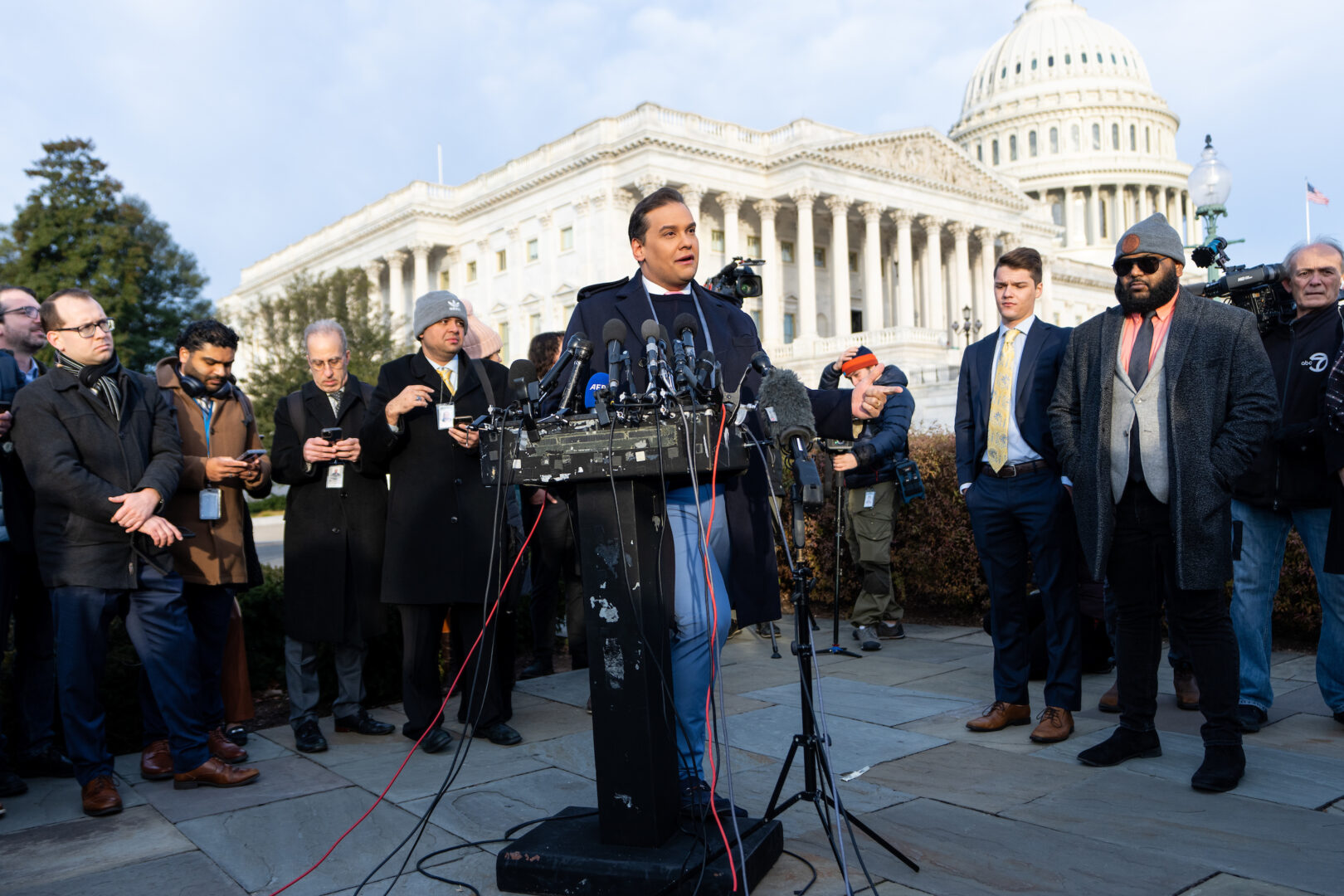 Then-Rep. George Santos, R-N.Y., holds a news conference outside the Capitol in November 2023 to discuss an upcoming vote to expel him from Congress. 