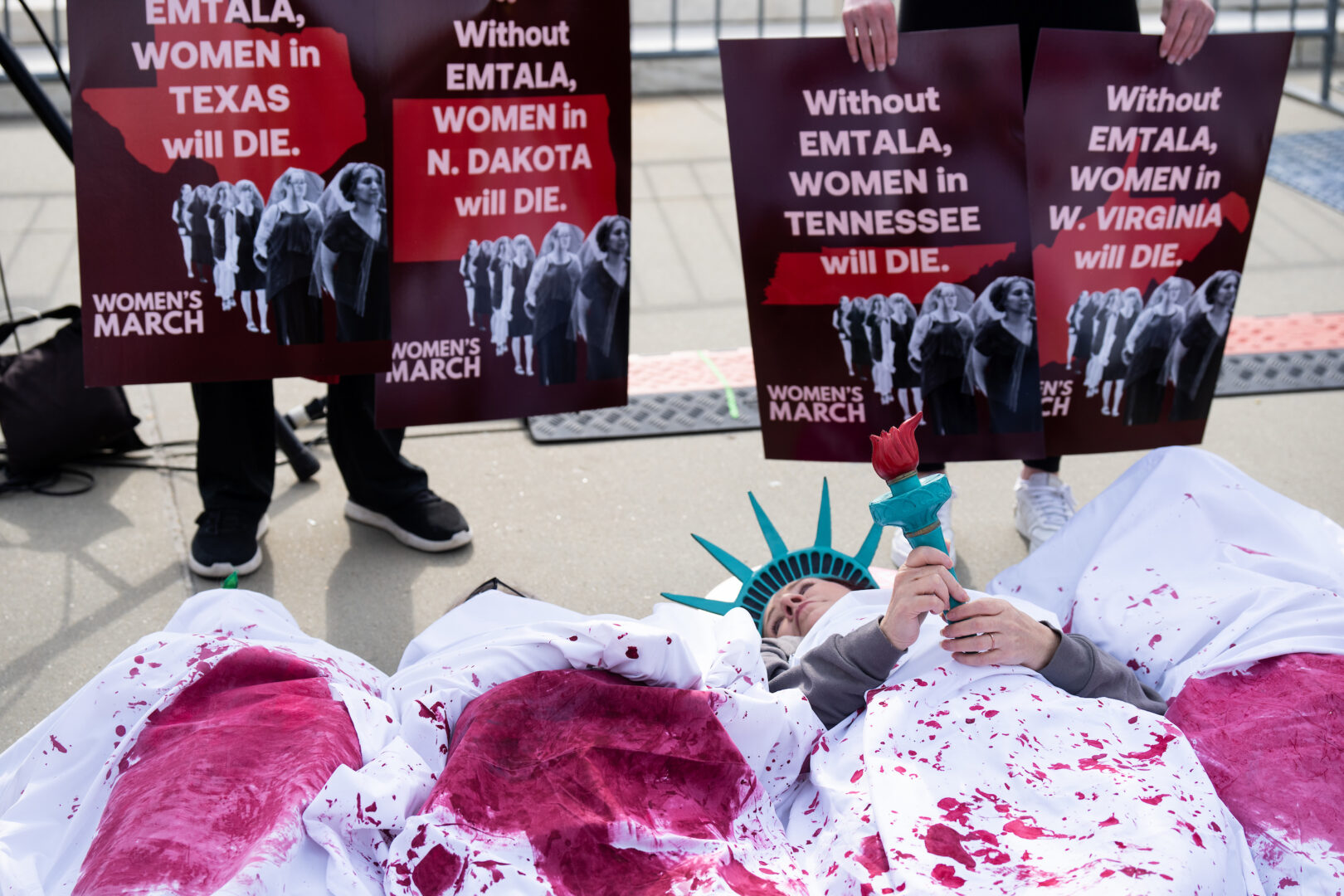 Women’s March holds a 'die-in' outside of the Supreme Court before the court’s oral arguments in Moyle v. United States in Washington on April 24.