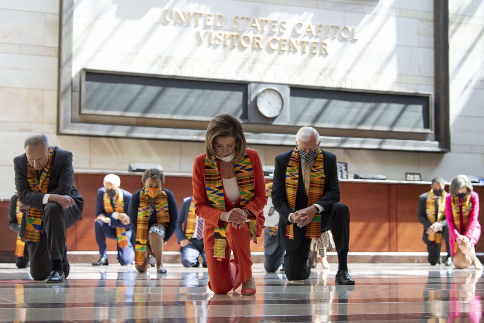 Members of Congress wearing Kente cloth kneel in Emancipation Hall for a moment of silence to honor George Floyd and victims of racial injustice in June 2020.