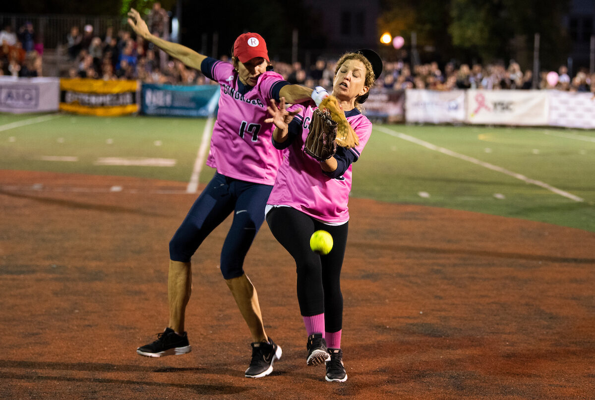 Cheri Bustos collides with Debbie Wasserman Schultz during the Congressional Women's Softball Game in 2021. Bustos will return to the game this year as an announcer.