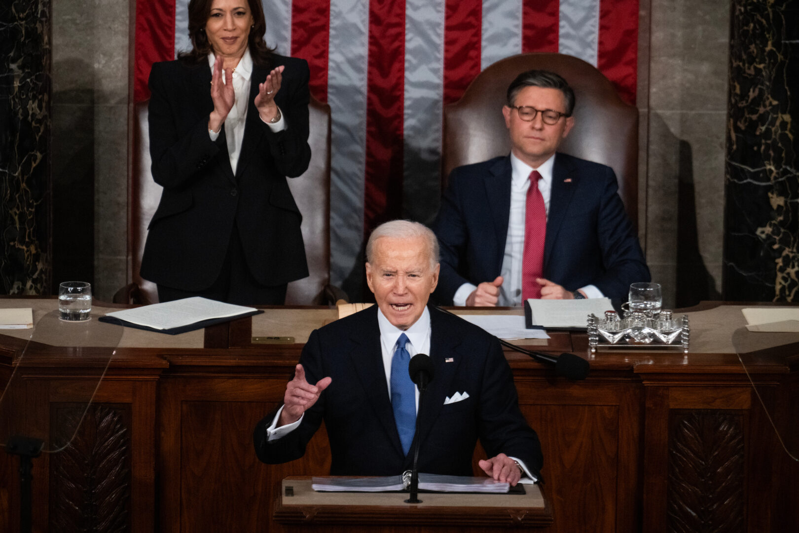 President Joe Biden delivers his State of the Union address in the House chamber on March 7 as Vice President Kamala Harris and Speaker Mike Johnson, R-La., look on.