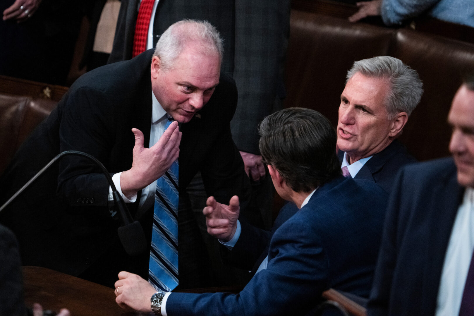 From left, Reps. Steve Scalise and Mike Johnson and Republican Leader Kevin McCarthy talk on the House floor during votes to choose a speaker on Jan. 6, 2023. 